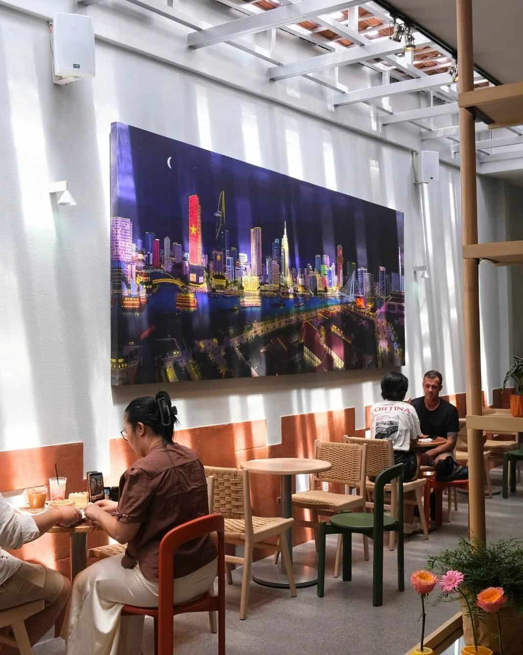 Jack Clayton's four-metre Saigon River print on the wall at Dulce de Saigon Thảo Điền